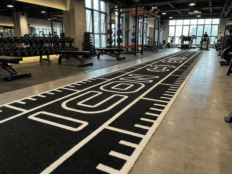 Dirty gym turf with chalk and debris